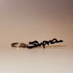 3D-printed Toyota Supra logo keychain in black
